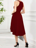 Woman wearing a burgundy dress with a white background
