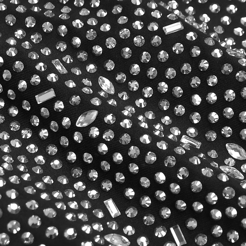 Close-up of black fabric with embedded clear rhinestones