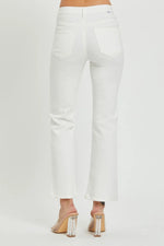 White pants worn by a person on a white background