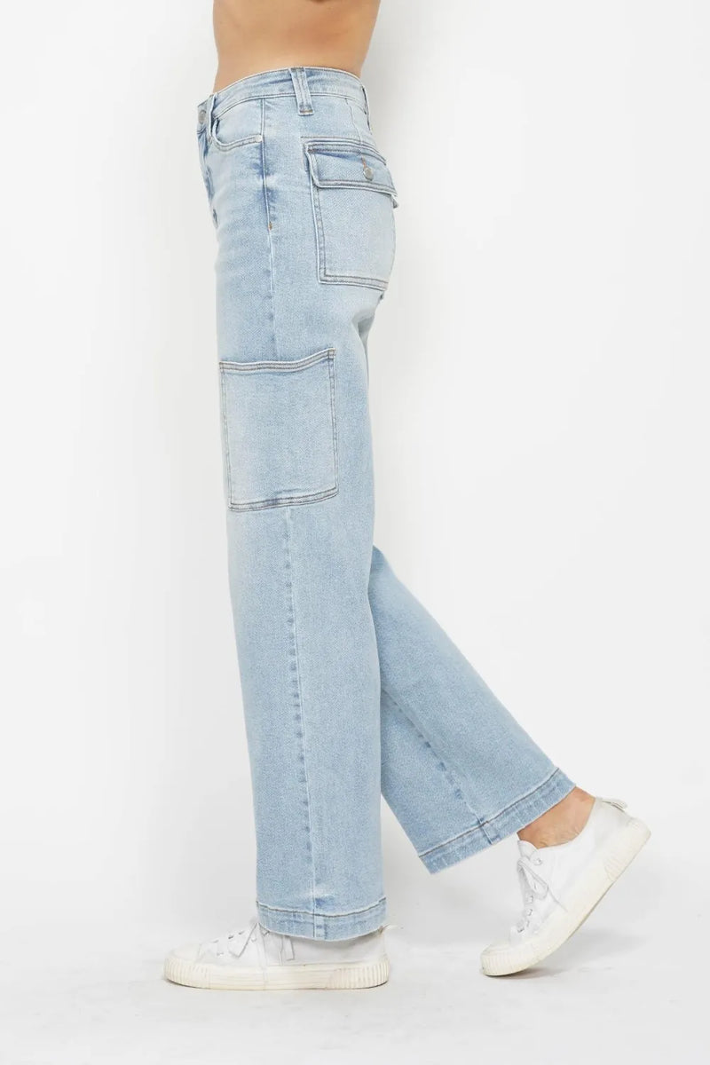 Light blue jeans worn by a person on a white background