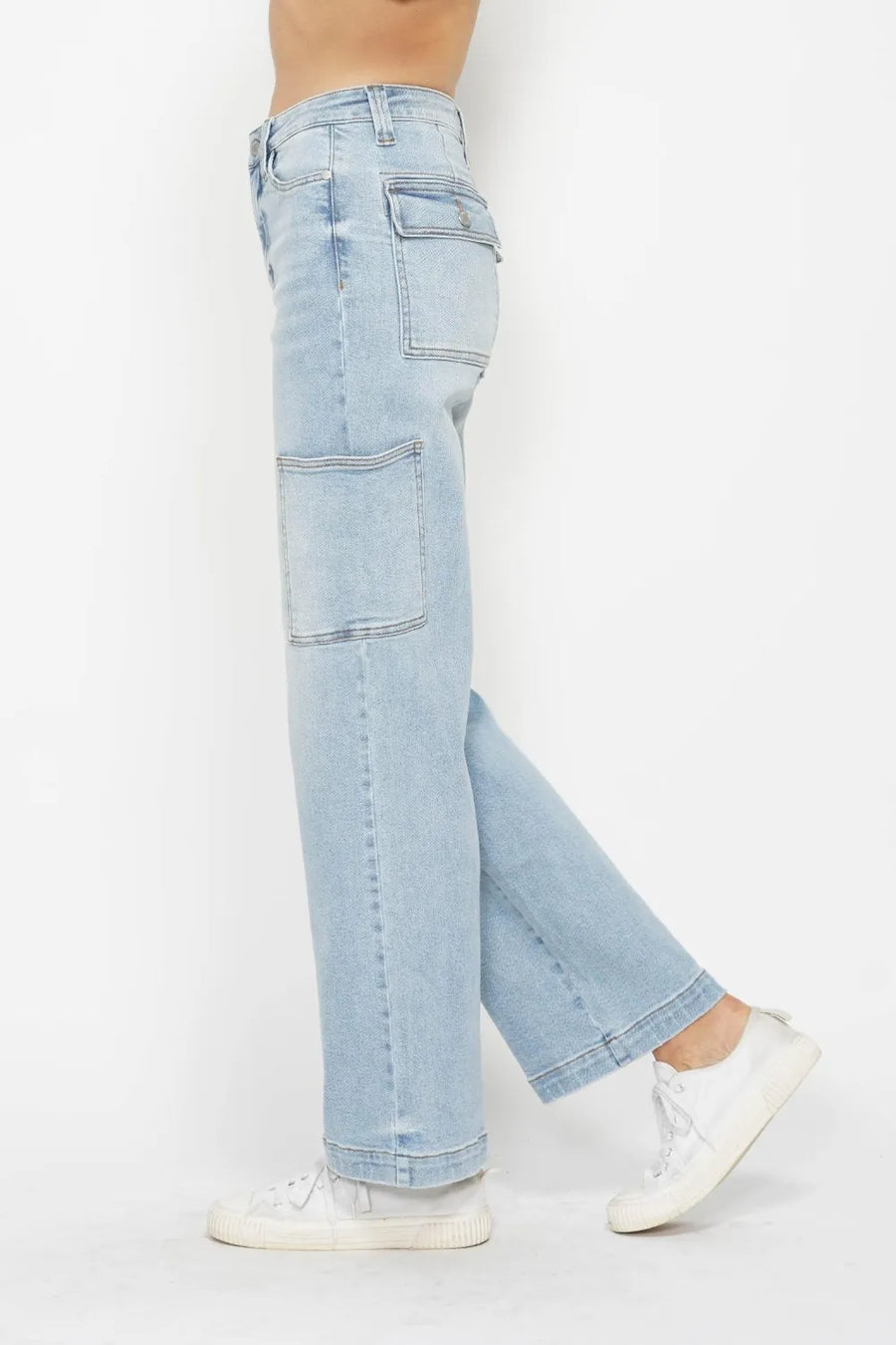 Light blue jeans worn by a person on a white background