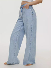Light blue jeans worn by a person on a white background