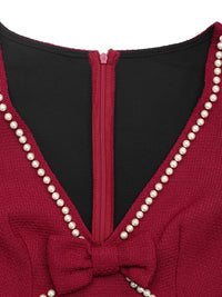 Red garment with pearl detailing and a black interior