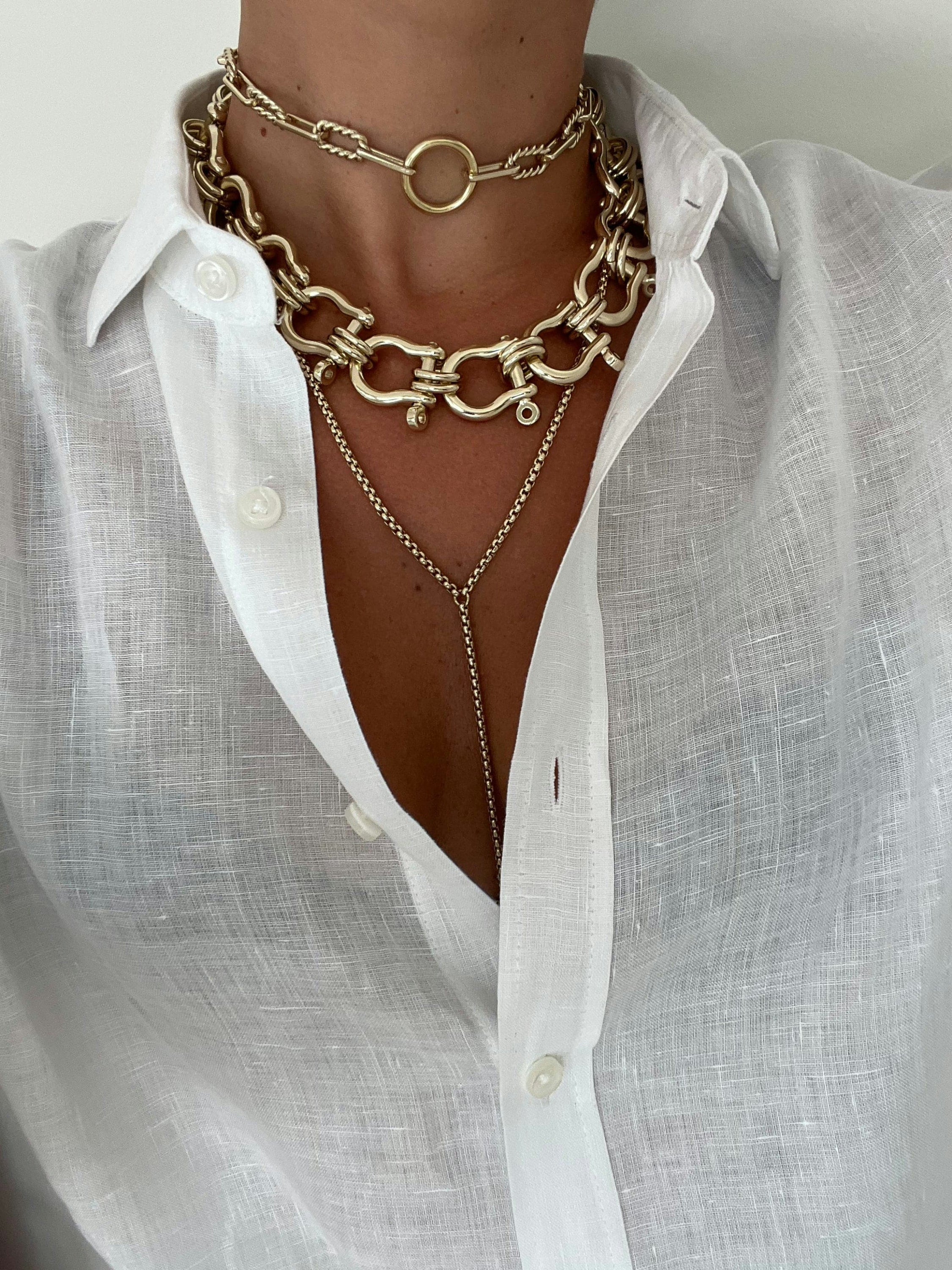 Model wearing a white shirt wearing Eliza Necklace 