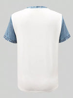 White t-shirt with blue denim sleeves on a gray background
