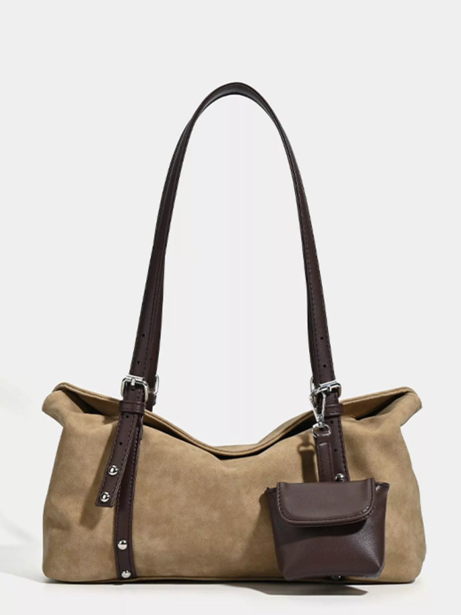 Brown handbag with a matching pouch on a white background