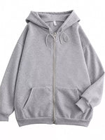 A light gray zip-up hoodie with a drawstring hood and front pockets, shown flat against a plain white background.