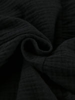 Close-up of dark textured fabric