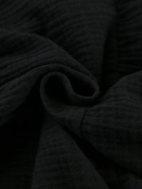 Close-up of dark textured fabric