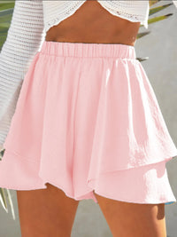 Pink skirt worn by a person with a blurred background