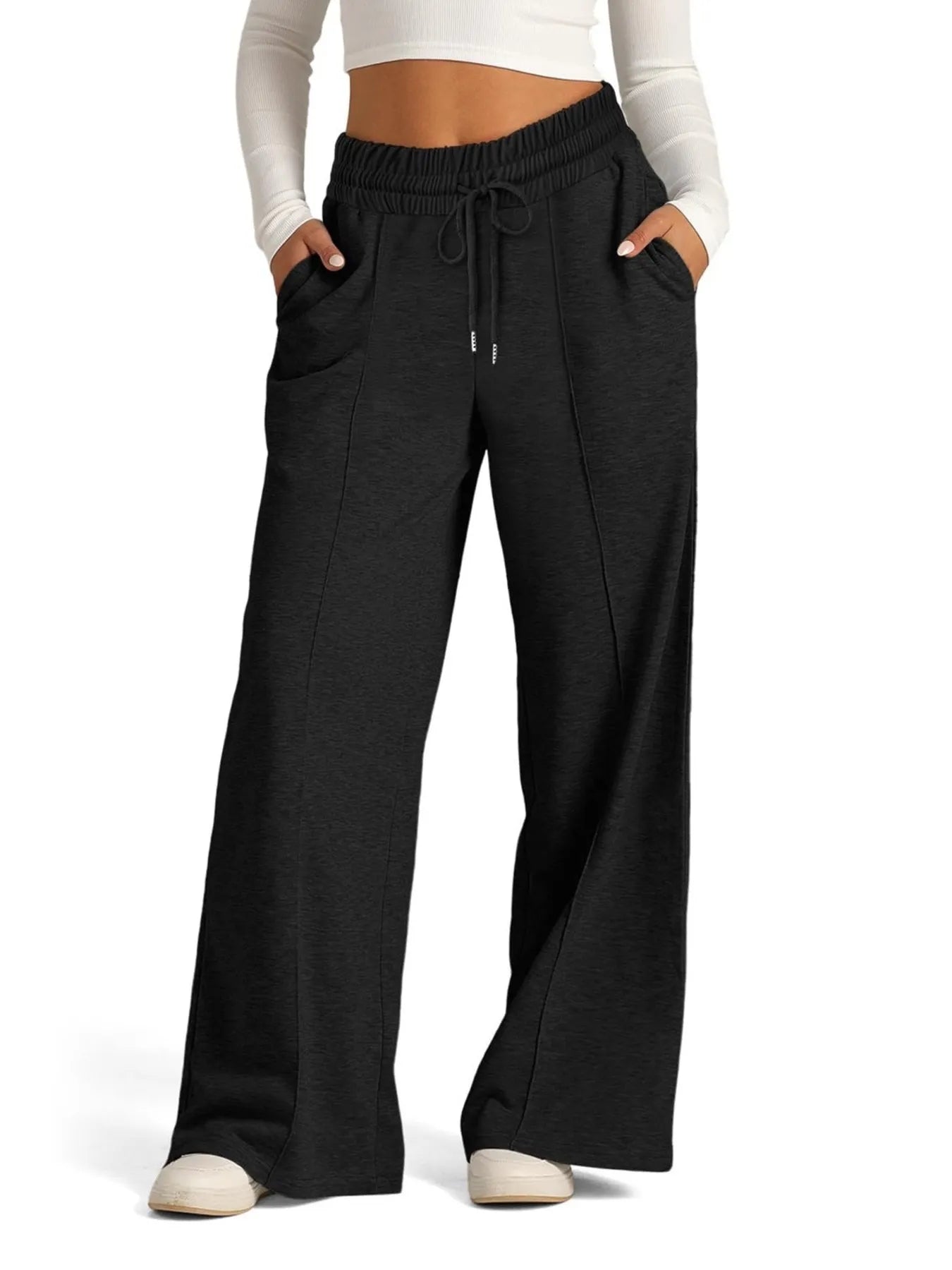 Black wide-leg pants worn by a person on a white background