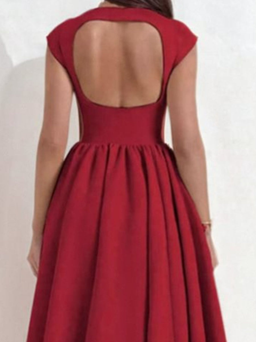 Red dress with open back on a white background