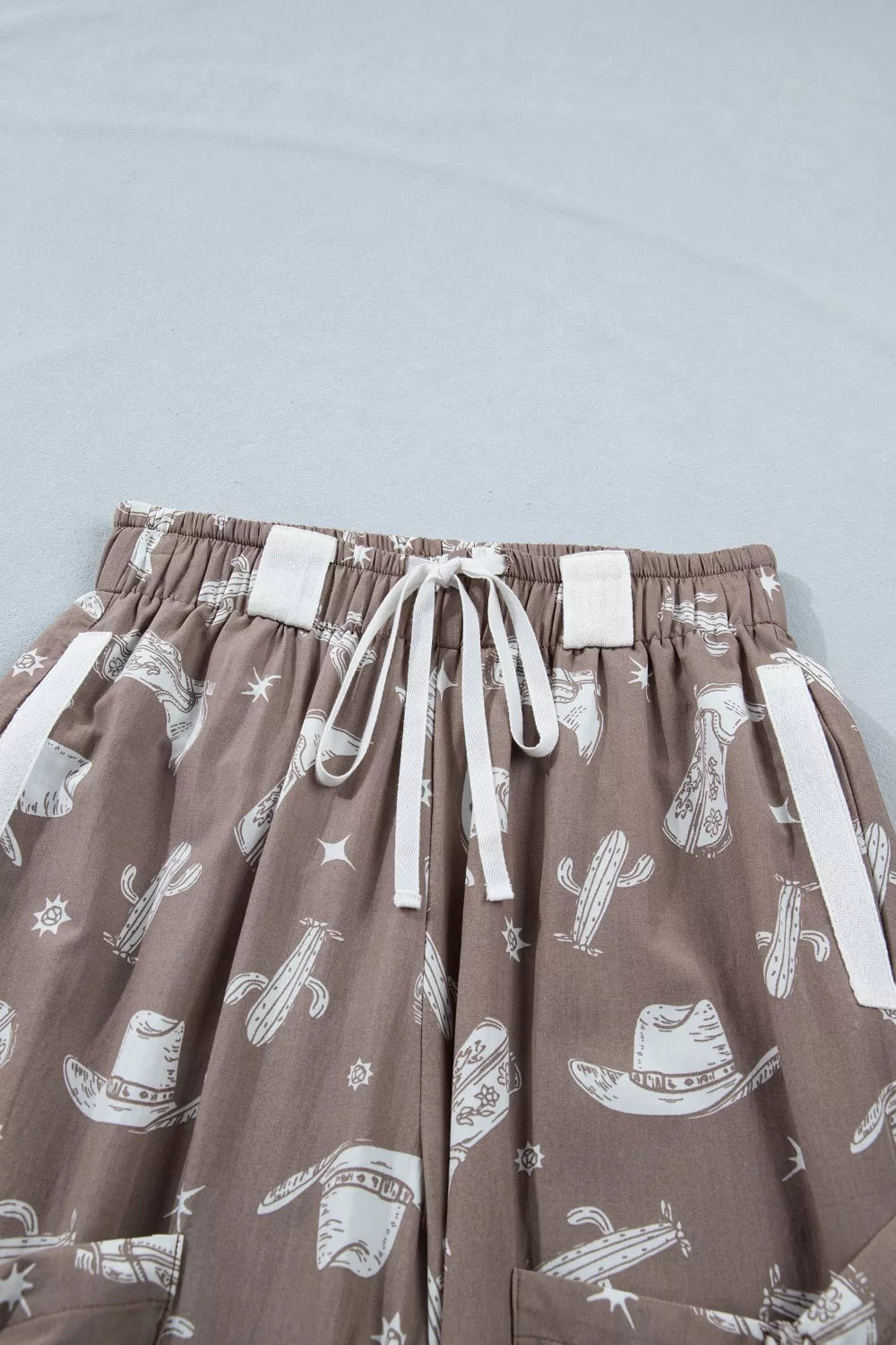 Brown skirt with white patterns on a light blue background