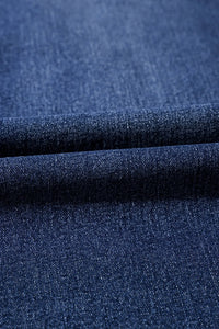 Close-up of blue denim fabric with a textured pattern