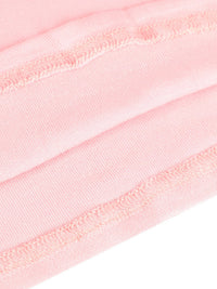 Close-up of pink ribbons with a white background