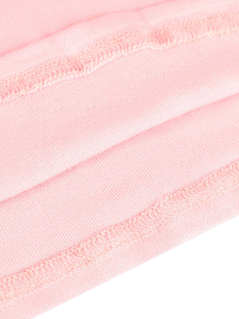 Close-up of pink ribbons with a white background