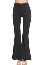 Black flared pants on a white background