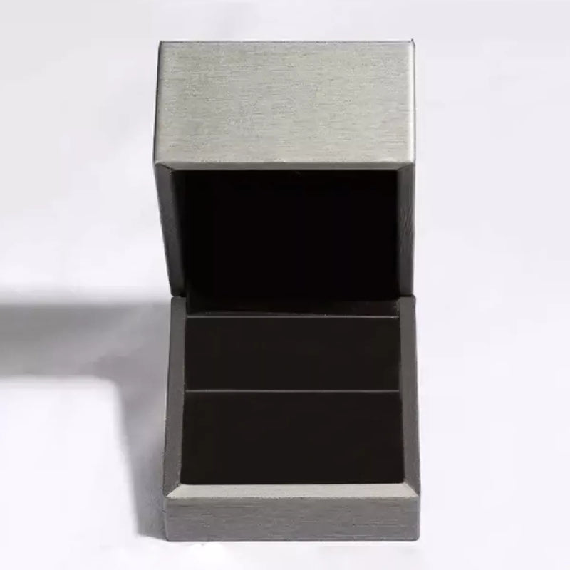Metallic gray rectangular box with a lid on a white background