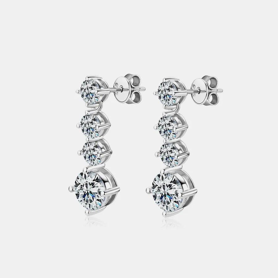 Pair of diamond earrings on a light gray background