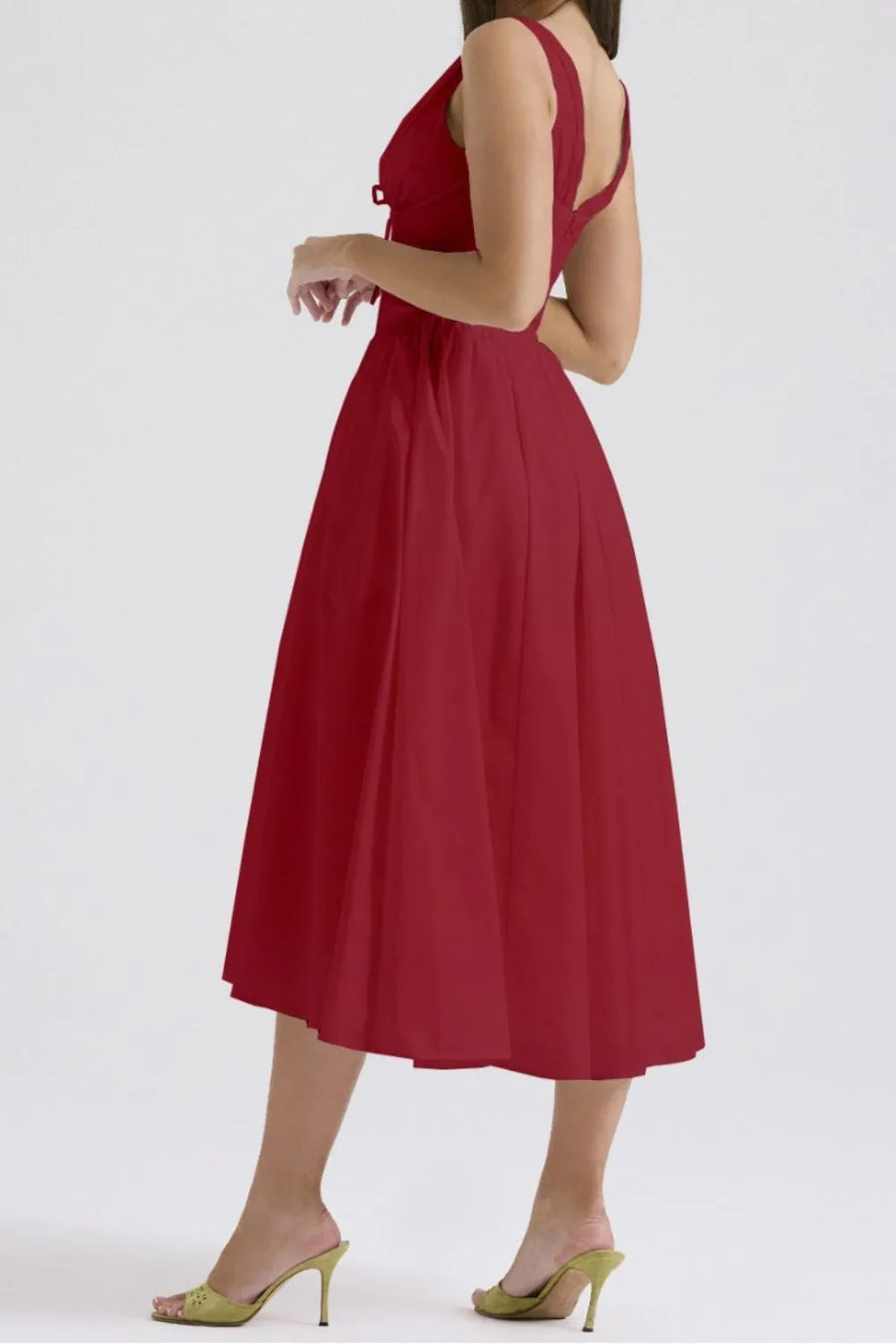 Red dress worn by a person on a white background