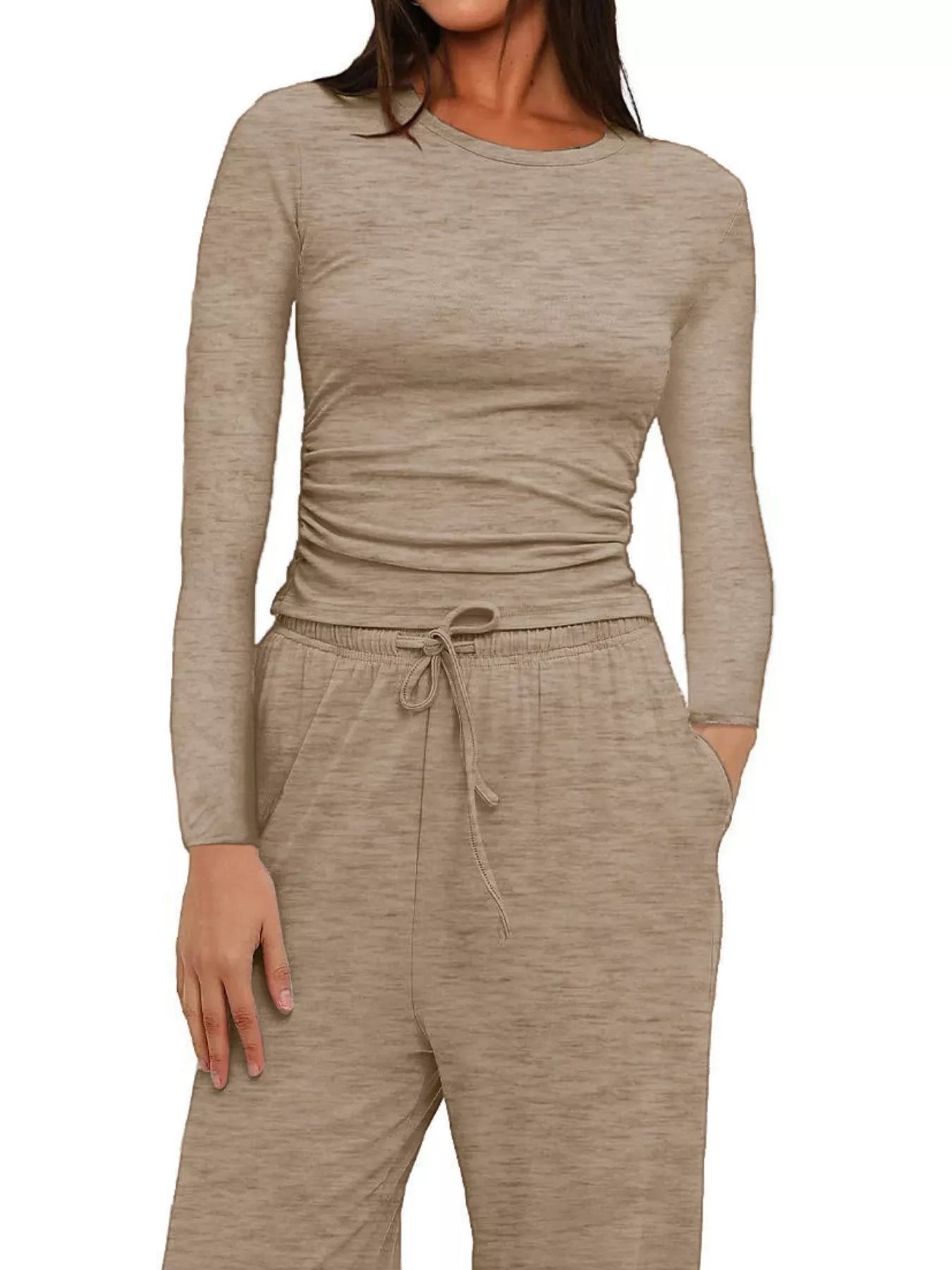 Beige long-sleeve top and pants set on a white background