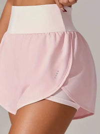 Pink skirt with white top on a plain background