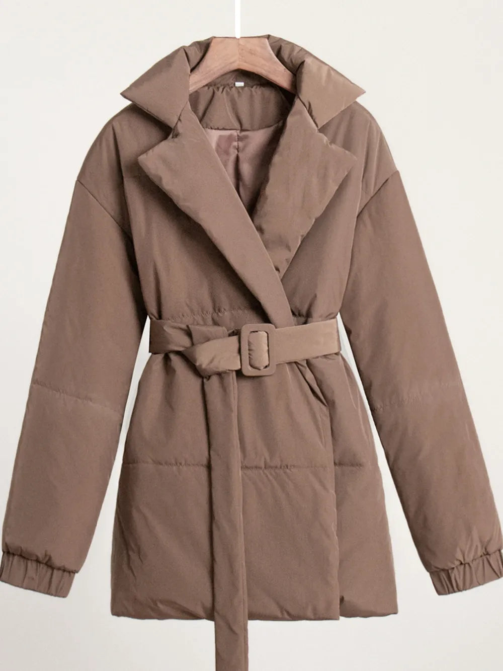 Brown puffer coat with a belt on a white background