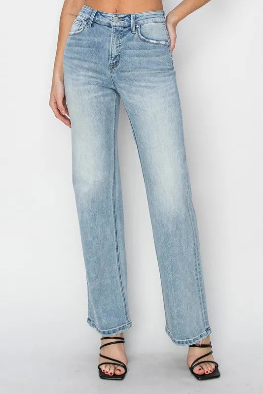 Light blue jeans worn by a person on a white background