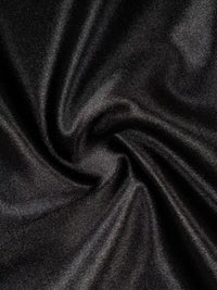 Close-up of dark gray fabric with folds