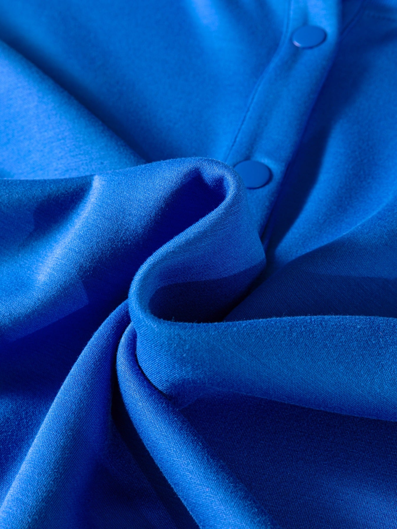 Close-up of blue fabric with buttons