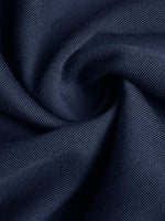Close-up of dark blue fabric with a textured pattern
