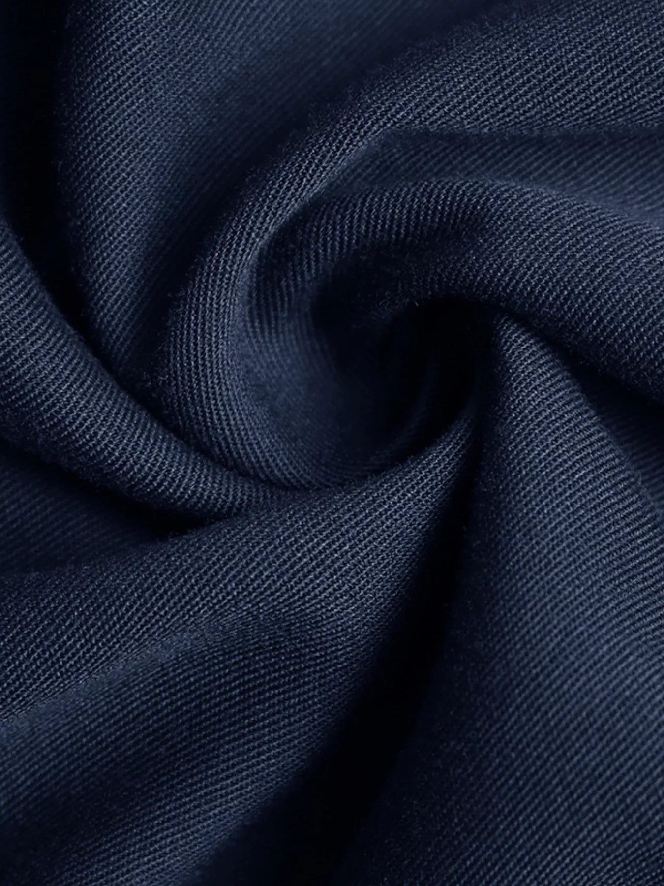 Close-up of dark blue fabric with a textured pattern
