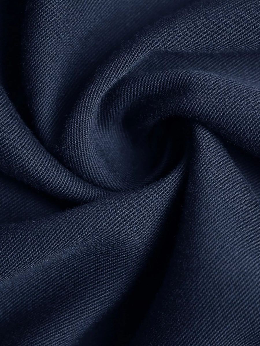 Close-up of dark blue fabric with a textured pattern