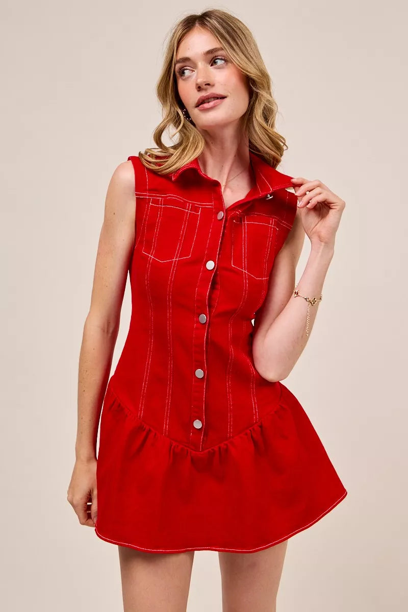 Woman wearing a red dress with a beige background