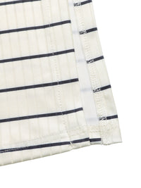 Close-up of a white fabric with black stripes on a white background