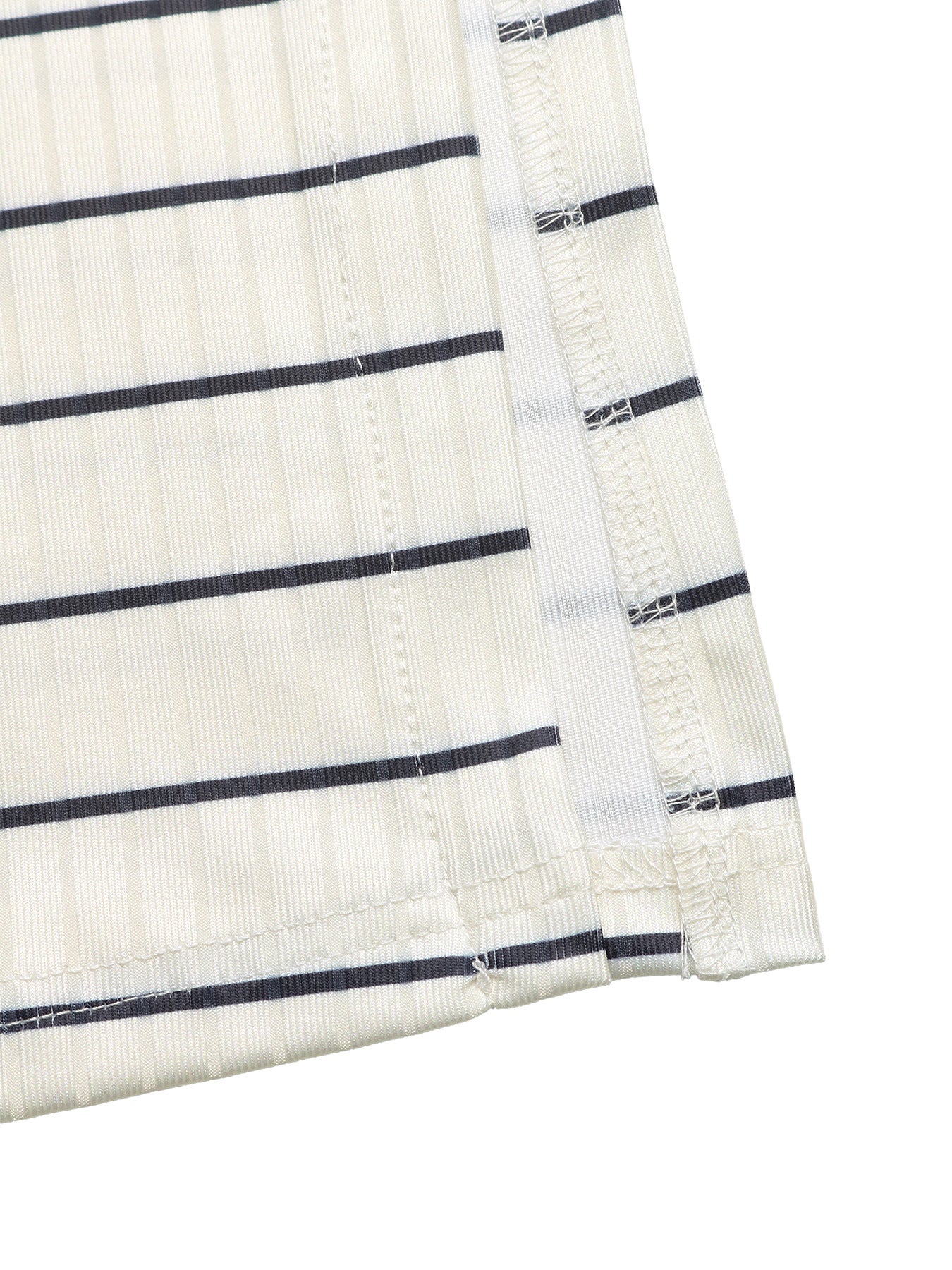 Close-up of a white fabric with black stripes on a white background