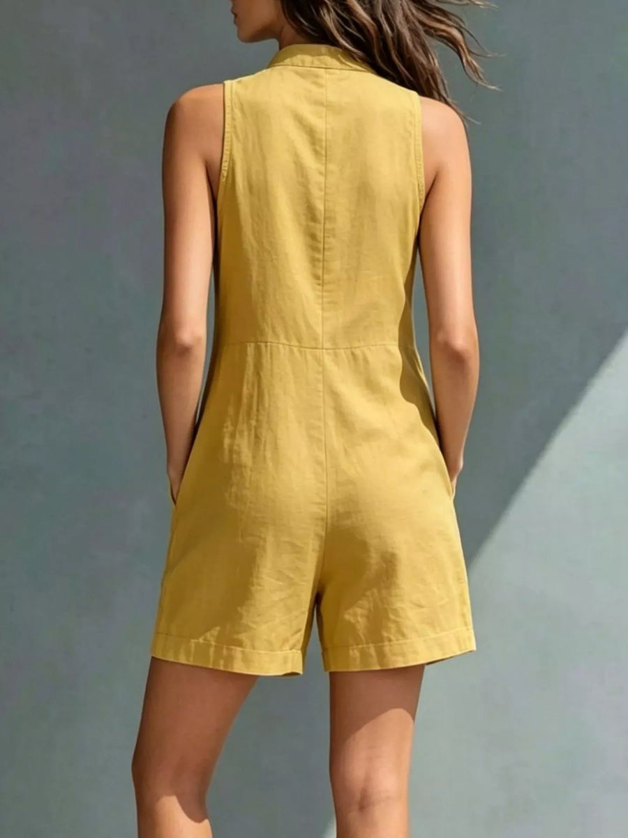 Yellow sleeveless dress worn by a person against a gray background