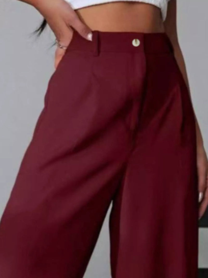 Maroon wide-leg pants worn by a person on a plain background