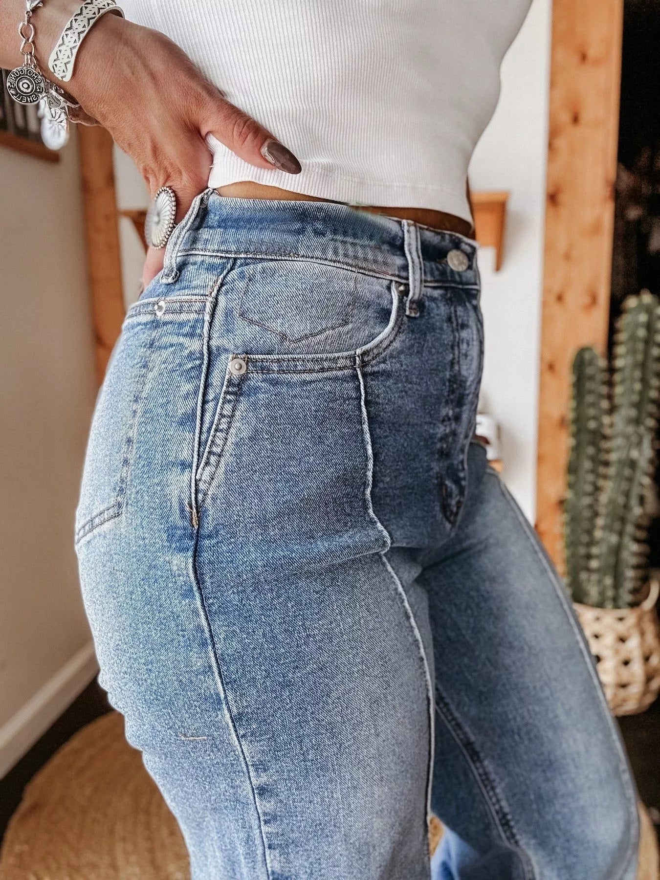 Person wearing blue jeans with a blurred background