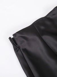 Close-up of a black jacket with a zipper on a white background