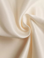 Close-up of beige fabric with folds