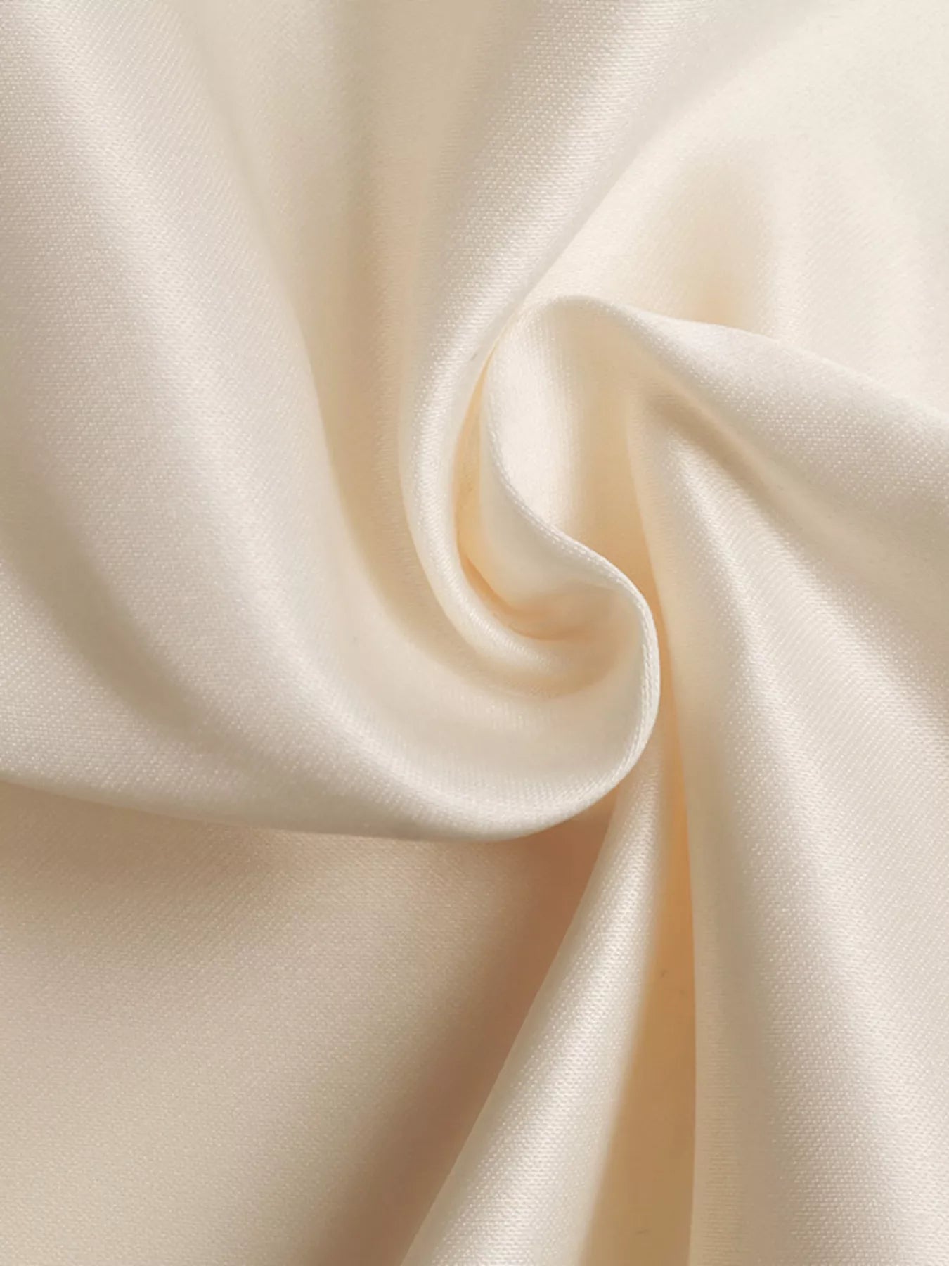 Close-up of beige fabric with folds