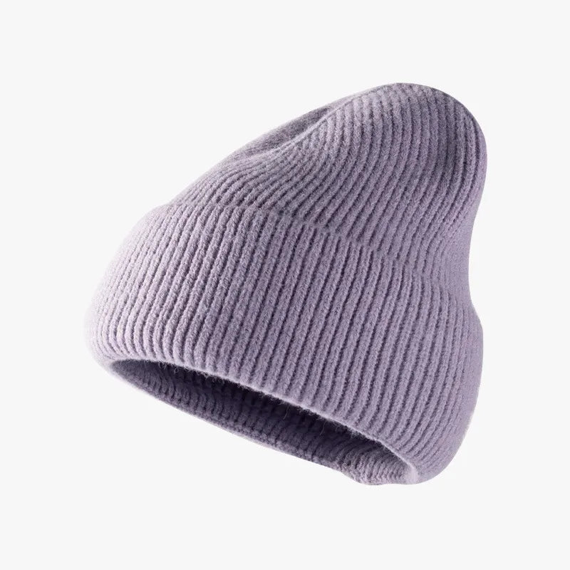 Purple knit beanie on a white background