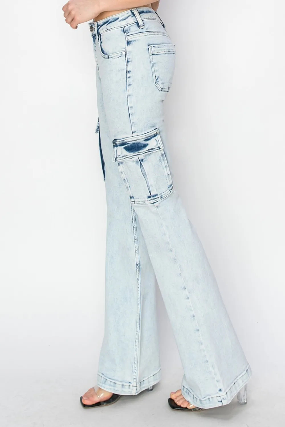 Light blue flared jeans on a white background