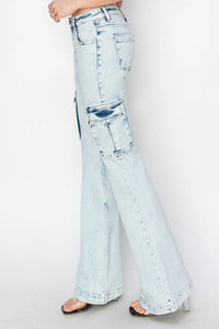 Light blue flared jeans on a white background