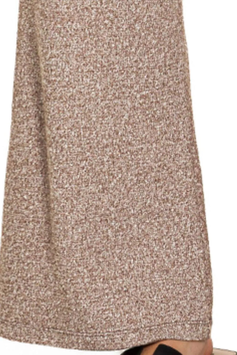 Close-up of a textured beige skirt on a white background