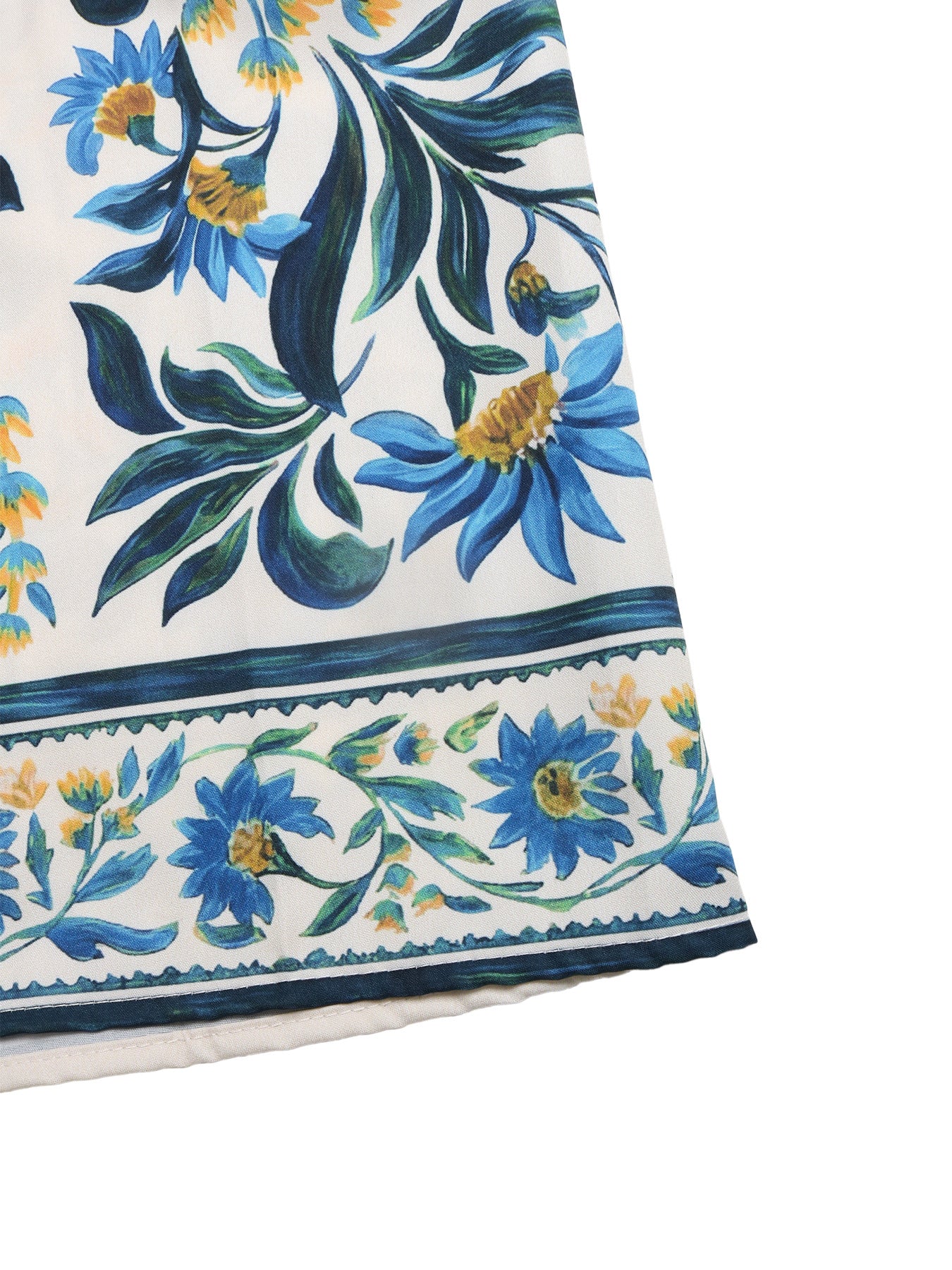 Floral patterned fabric with blue and green flowers on a white background