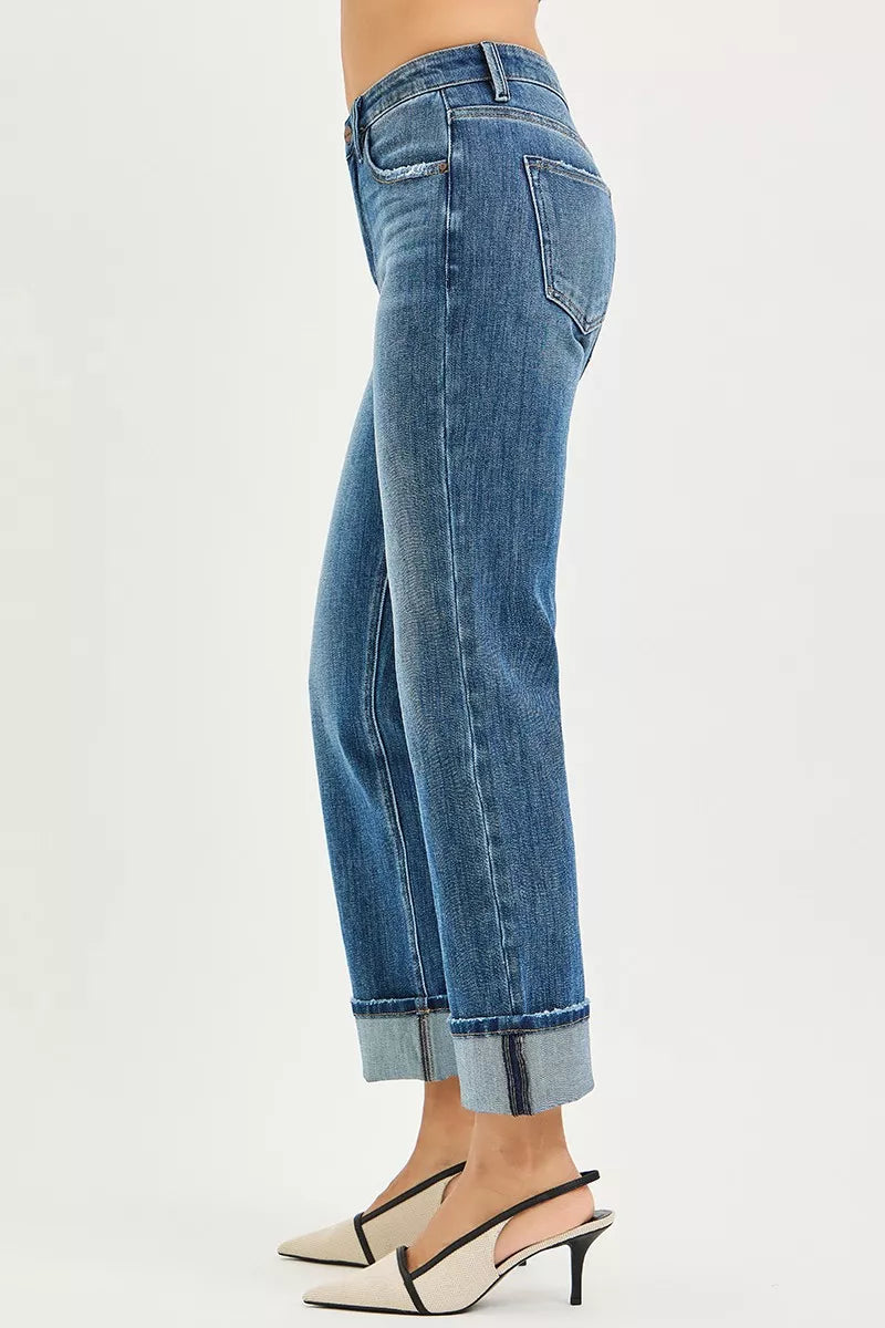 Blue jeans worn by a person on a white background