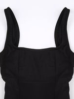 Black dress with thin straps on a white background