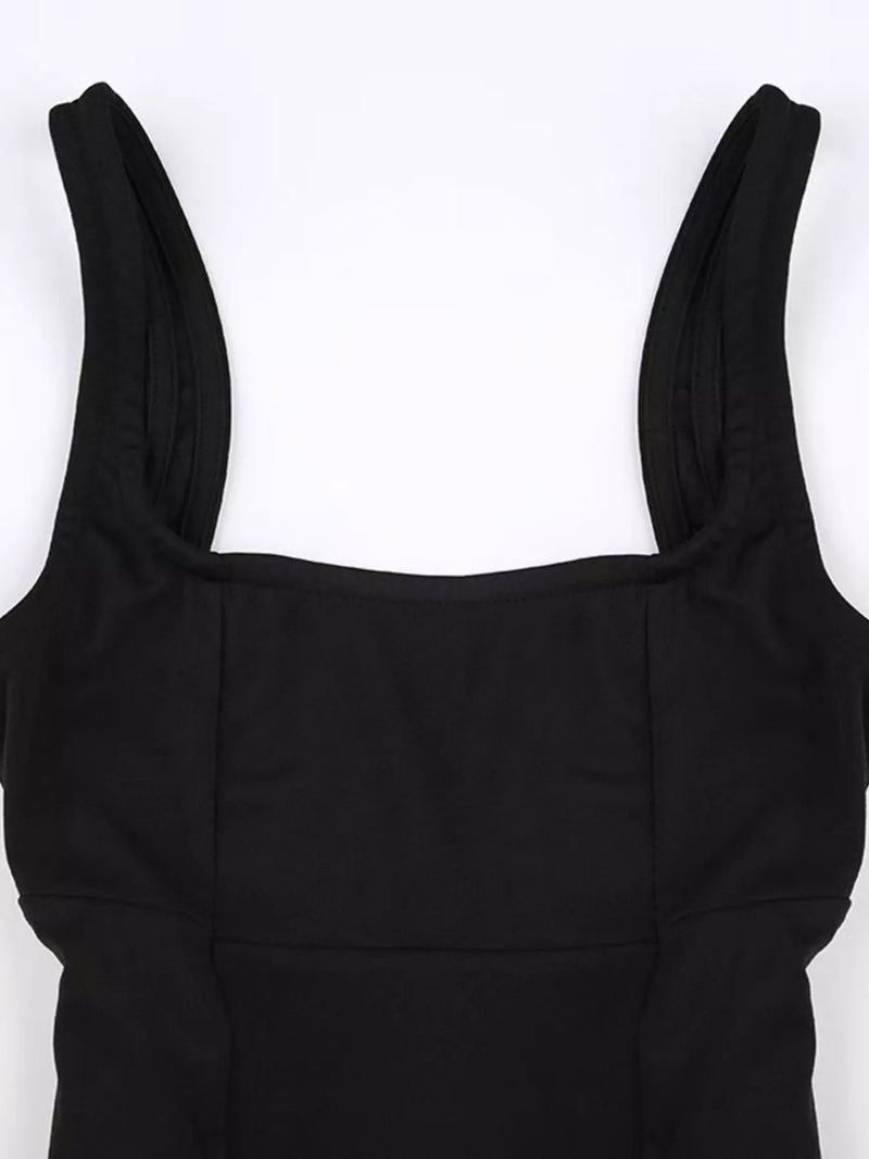 Black dress with thin straps on a white background